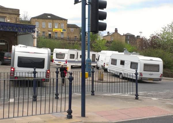 MOVED ON: Travellers arrived in Dewsbury railway station car park last week.