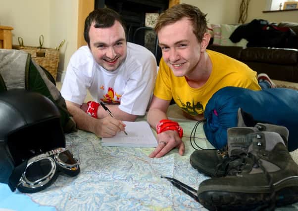 MAPPING OUT Aaron Livsey and Greg Horsfall make plans at Aarons mums house  in Upper Hopton. (d553b320)