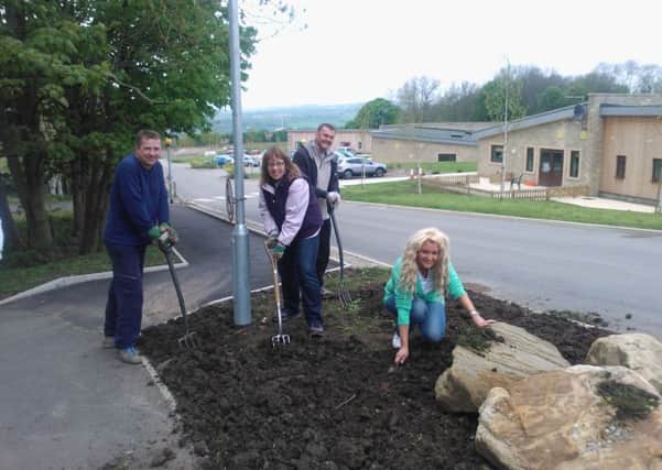Staff from Lloyds TSB volunteer at Hollybank as part of Give and Gain Day
