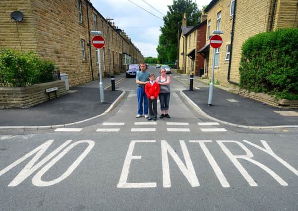PAY ATTENTION! Les Robertson, pictured with family members Laura and Becky Potts, has been left fuming after watching drivers ignore the  no entry signs  at the junction of Myrtle Road and Garden Street. (D536C323)