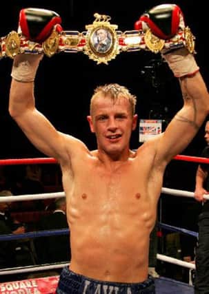 Gary Sykes celebrates winning the Lonsdale belt. 
Front page of supplement.
