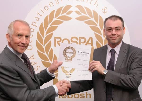 GOLD AWARDS RoSPA trustee John Clayton, left, presents Rixonway's operations manager Mark Evans with the awards.