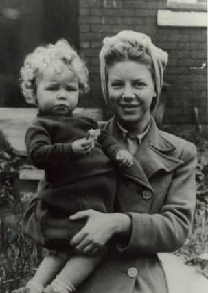 The little girl with the blonde curls is Christine Mallinson, who wrote the monologue below. She is being held by her sister Shirley, who was aged about 16,and who had just come home from the mill where she worked when the picture was taken.