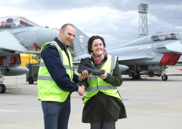 ALL SMILES Rob Huckle of the RAF Typhoon Display with Abby Steele of Cleckheaton's  YDS Boots