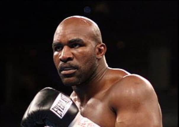 KNOCK OUT Boxing champion Evander Holyfield.