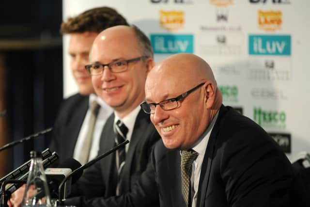 Outgoing chief executive Shaun Harvey (centre) is pictired with new Leeds United managing director David Haigh (left) and manager Brian McDermott.