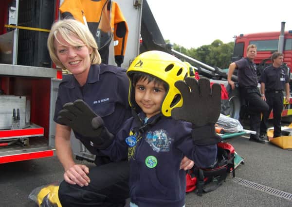 Fire and Rescue officer Christina Lee pictured with Jai Singh Kundi at the Birkenshaw fire service gala. (d11071127)