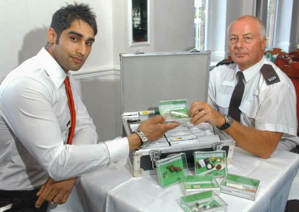 Omer Ashgar with PC Peter Whitehouse, who have teamed up for a drugs awareness project at mosques across north Kirklees.