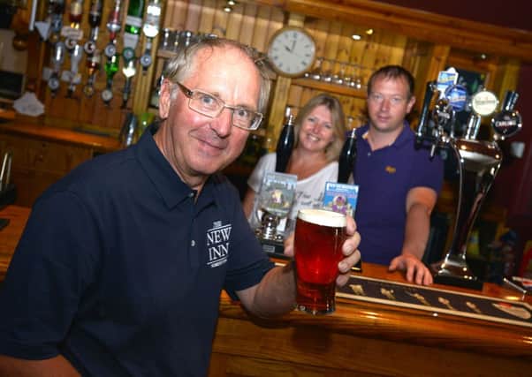 Josef Kenyon with his Yorkshire Bob beer, brewed with rhubarb, at the New Inn pub in Roberttown which is run by his son Andy and Susan Walker.