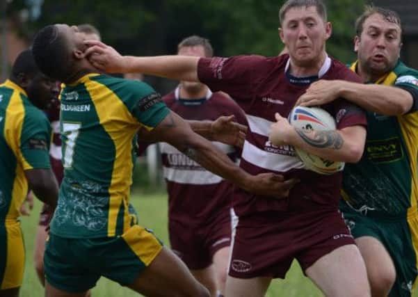 Tom Holdsworth in action for Thornhill Trojans against Moldgreen