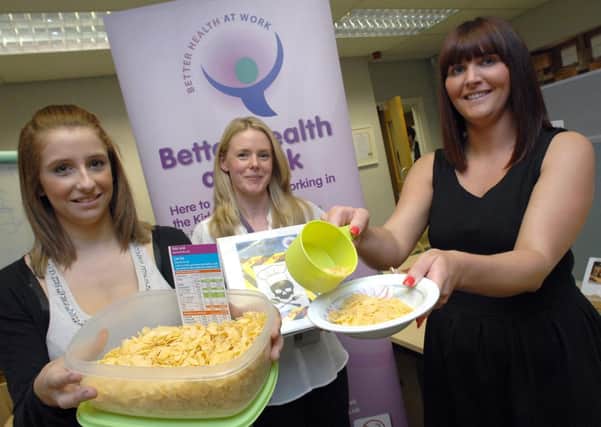 HEALTH BOOST Rixonway's Toni Larkin and Kelly Austin  with Gemma Seepujak of Kirklees Council.