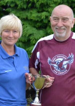 Overthorpe Sports Club retained the Jim Wadsworth Memorial Trophy. Event organiser Tony Hammond pictured with Morton House captain Mandy Hyde