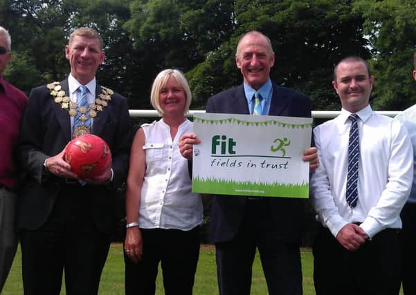 QUEEN'S FIELD Cllr Martyn Bolt with  Chris Cobley, Trustee of Fields in Trust, Keith Johnson of Battyford Sports Club, Kirklees Parks manager Robert Whittaker,  Maxine Green, Asda Community Life Champion and Sam Patterson from the Morley branch of ASDA.