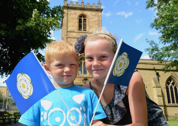 McKenzie Thomasson and Emily Grason taking part in the Yorkshire day celebrations at Dewsbury minster. (d604a333)