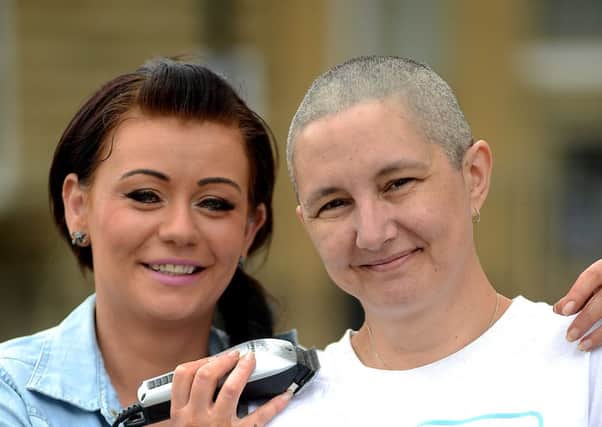 Carol McCromack from Mirfield. Pictured after her head shave, which raised money for Diabetes UK. Also in picture is Pam Inham - hairstylist who performed the head shave.
d310d334
