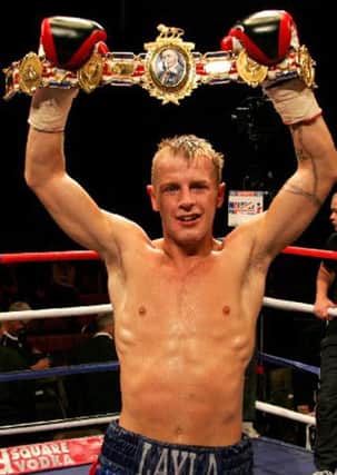 Gary Sykes celebrates winning the Lonsdale belt. 
Front page of supplement.