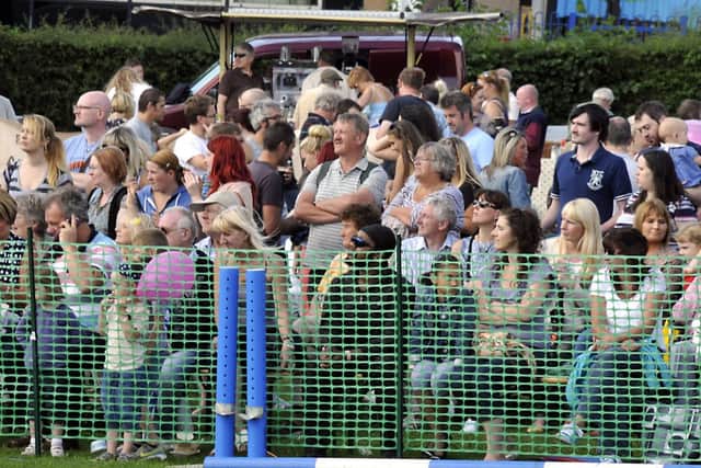 Crowds watch a main event in the ring at Mirfield Show.