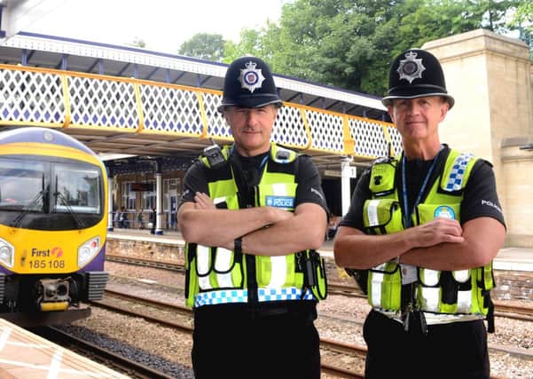 British Transport Police Sgt Rudy Tangle and PC Barry Calvert at Dewsbury Train Station. (d623c336)