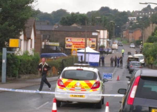 Police closed Heckmondwike Road after a body was found in a burning van.