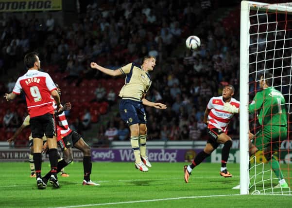 Scott Wootton scores on his debut for Leeds United at Doncaster Rovers.