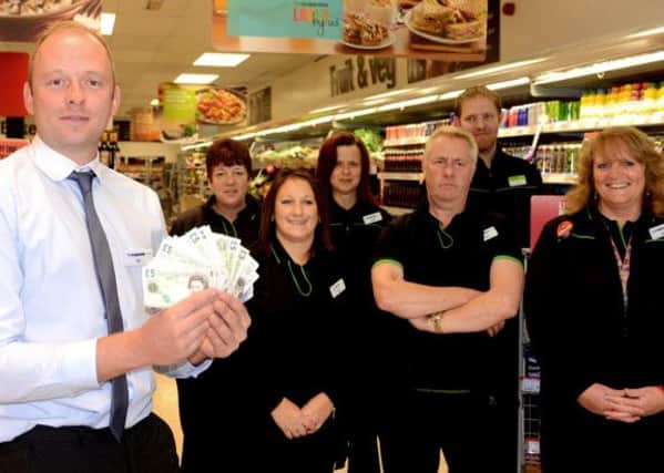 Store manager Dan Pellisier and his team at the Co-op in Wyke.(d612a339)