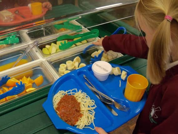 Younger children will be entitled to free school meals from next year.