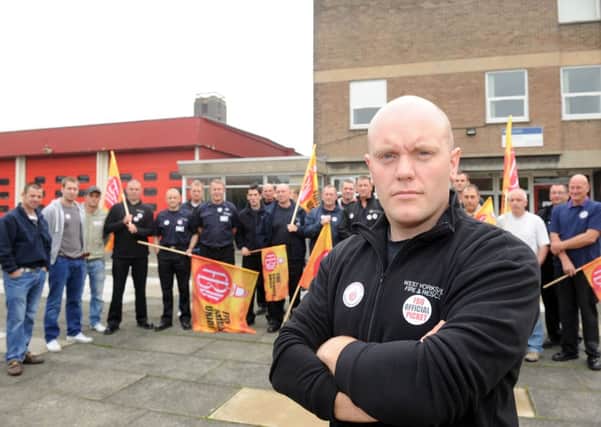 TAKING ACTION FBU rep Matt Herrin with firefighters on strike at Wakefield Fire Station.