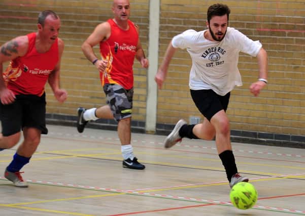 GAME ON Players in action at the Reporter Series Fund football tournament.