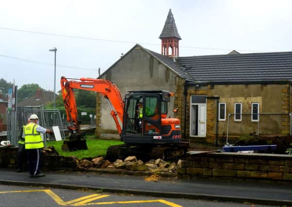 Diggers move onto the Walker Welfare Centre site on Wednesday. (D536B341)