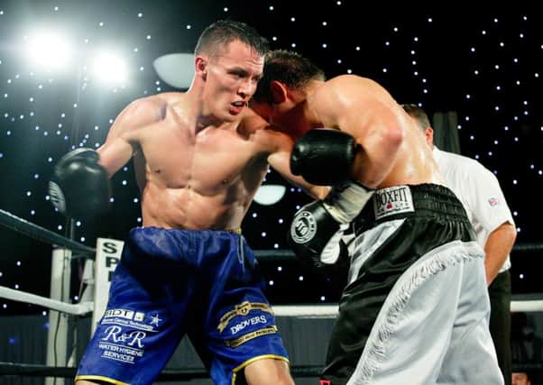 josh warrington produced a thoroughly professional performance in which he controlled the clash with Ian Bell from the outset to retain the English title. Pictures: Javed Iqbal