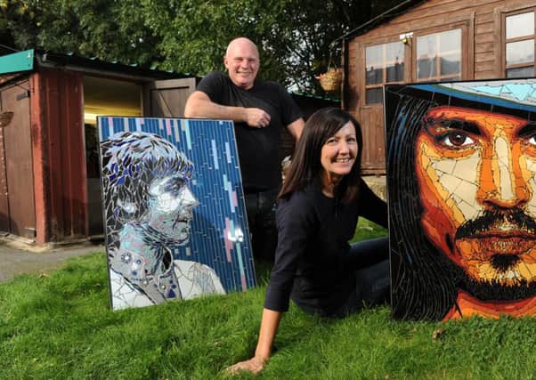 Mosaic artists Allan Butt and Rita Gav with portraits of Paul McCartney and Johnny Depp  that will feature in their exhibition, Icons of Stage, Screen andStadium, at Liverpools View Two Gallery in Mathew Street, Liverpool.  24 September 2013.  Picture Bruce Rollinson