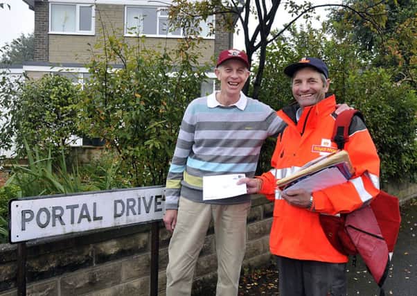 David Smith delivers mail to Frank Irish in Portal Drive, Mirfield.
