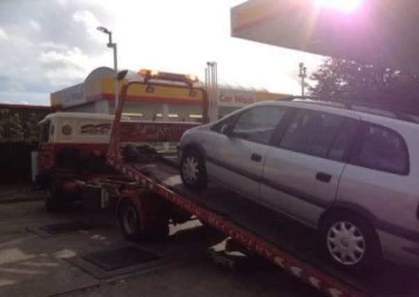TOWED AWAY A car seized by the road policing unit for having no insurance.