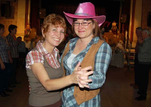 YEE-HAA!: Jennifer Jenkins and Julie Land at a previous Batley Business Assocation barn dance. (d15101170)