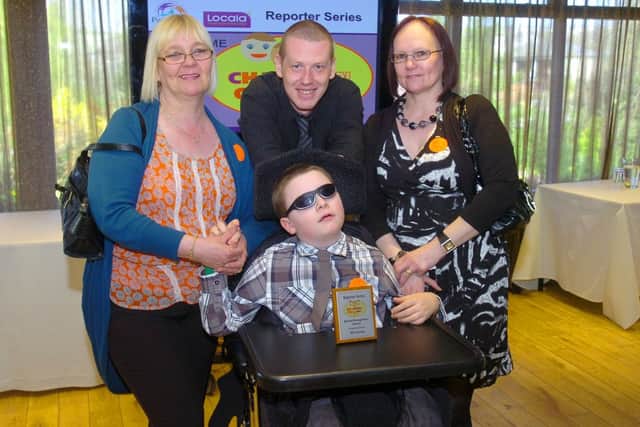 Champion Child Tyler Jessop with his family. (d27031273)