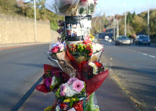 Flowers at the scene where Sarah Binns was killed in an accident in Woodkirk on Sunday morning. (d650c346)