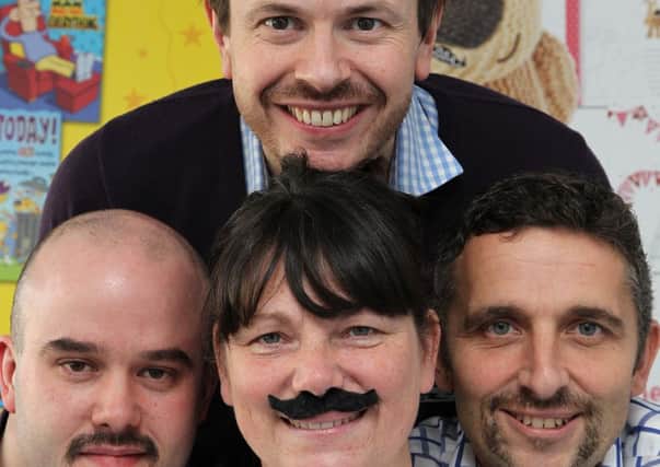 Melanie Freeman is joining her male colleagues by taking part in Movember - donning a fake tasche for a full day every week when she is out and about for work. with Chris Grayson, Charlie Ratcliffe and Adrian Smith