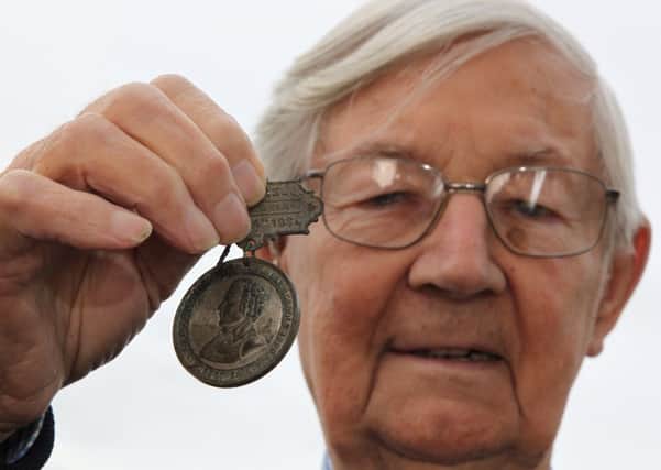 HERITAGE UNCOVERED Jeffrey Stead discovered a medal dating back to 1880 in his coin collection. (d235b344)