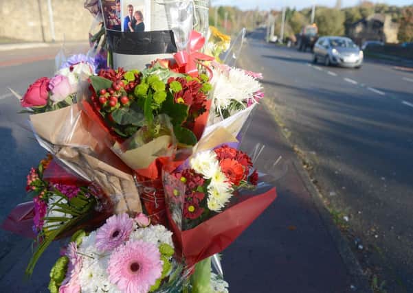 Flowers at the scene where Sarah Binns was killed in a car crash on Dewsbury Road, Woodkirk. (d650f346)