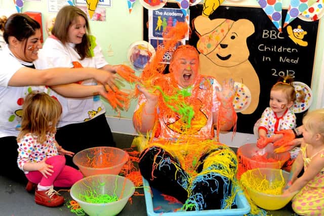 Carrie-Ann Nield from Academy Childcare at the Mill  sitting in a bath of spaghetti for Children in Need. (d601a347)