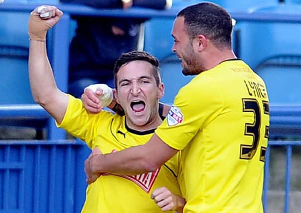 Martin Paterson celebrates his goal with Joel Lynch. Picture James Hardisty