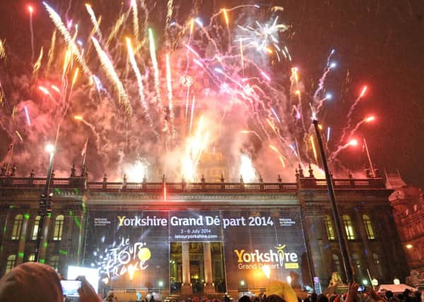 Fireworks light up the sky above Leeds Town Hall in celebration of the Yorkshire Grand Depart Le Tour de France 2014.