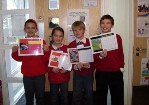 Children from Old Bank Junior and Infant School swapped lessons for an early taste of working life at Mirfield Childrens Centre. Pictured are Anasztazia Kanya, Coby Perks, Ben Carpenter and Courtney Locke