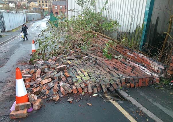 ROAD BLOCK A wall collapsed in Carlton Road, Batley Carr