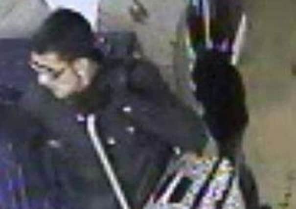 CAUGHT ON CAMERA This man took a suitcase from a train which stopped at Dewsbury.