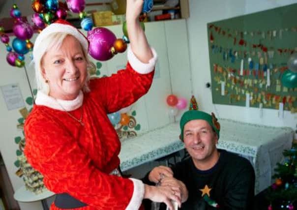 Susan and Michael Crossland help spread Christmas cheer