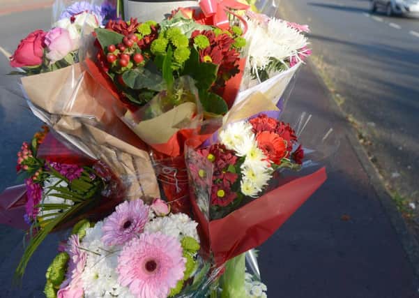 Flowers at the scene where Sarah Binns was hit by a car in Dewsbury Road, Woodkirk. (d650f346)