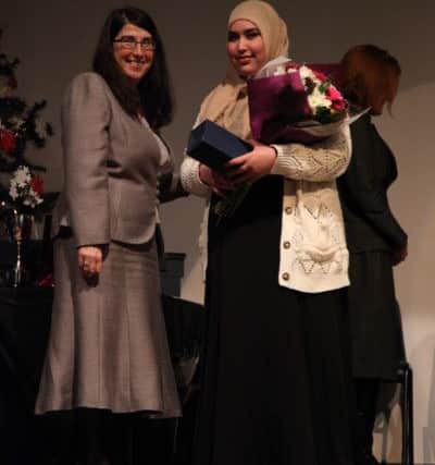 STAR STUDENT Asmaa Rasool recieves the prize for overall transformation from executive headteacher Jackie Eames.