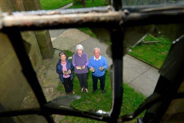St Paul's Church in Hanging Heaton is being targeted regularly by vandals. The problem has become so great that police and councillors are now involved. Jean and Brian Glover with church warden Pat Mosley (middle). (D531D319)