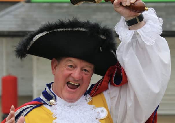 JUNE 2013 Town crier Russell Booth helped evacuate a burning supermarket in Mirfield.